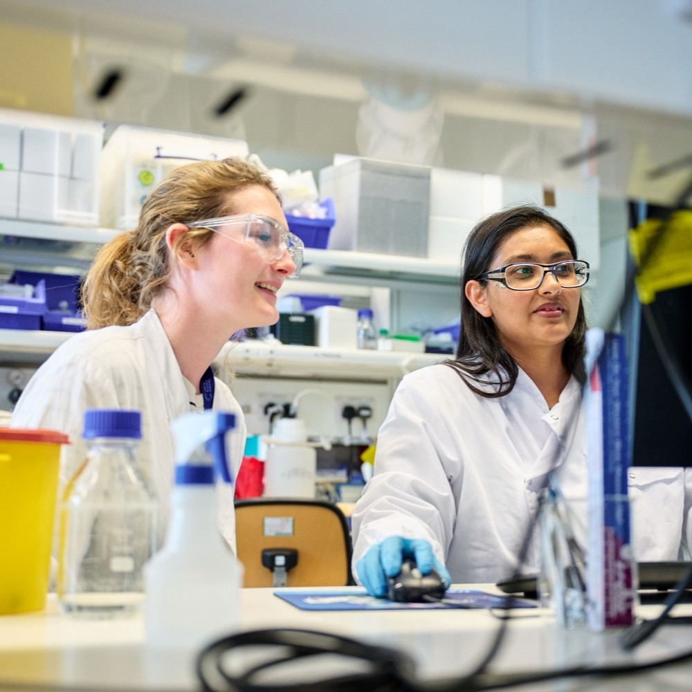 Two scientists working in a lab.